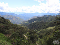 Looking down on the deep canyon below carved into the mountainous landscape of rural Peru.