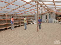 One of the indoor coffee drying rooms at the coffee cooperative where patio space and raised drying beds are employed to dry the coffee of coop members. Kerinci, Sumatra.
