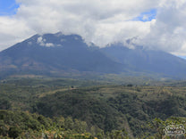 Volcan Acatenango lets off some mid-day steam near the town of Antigua.