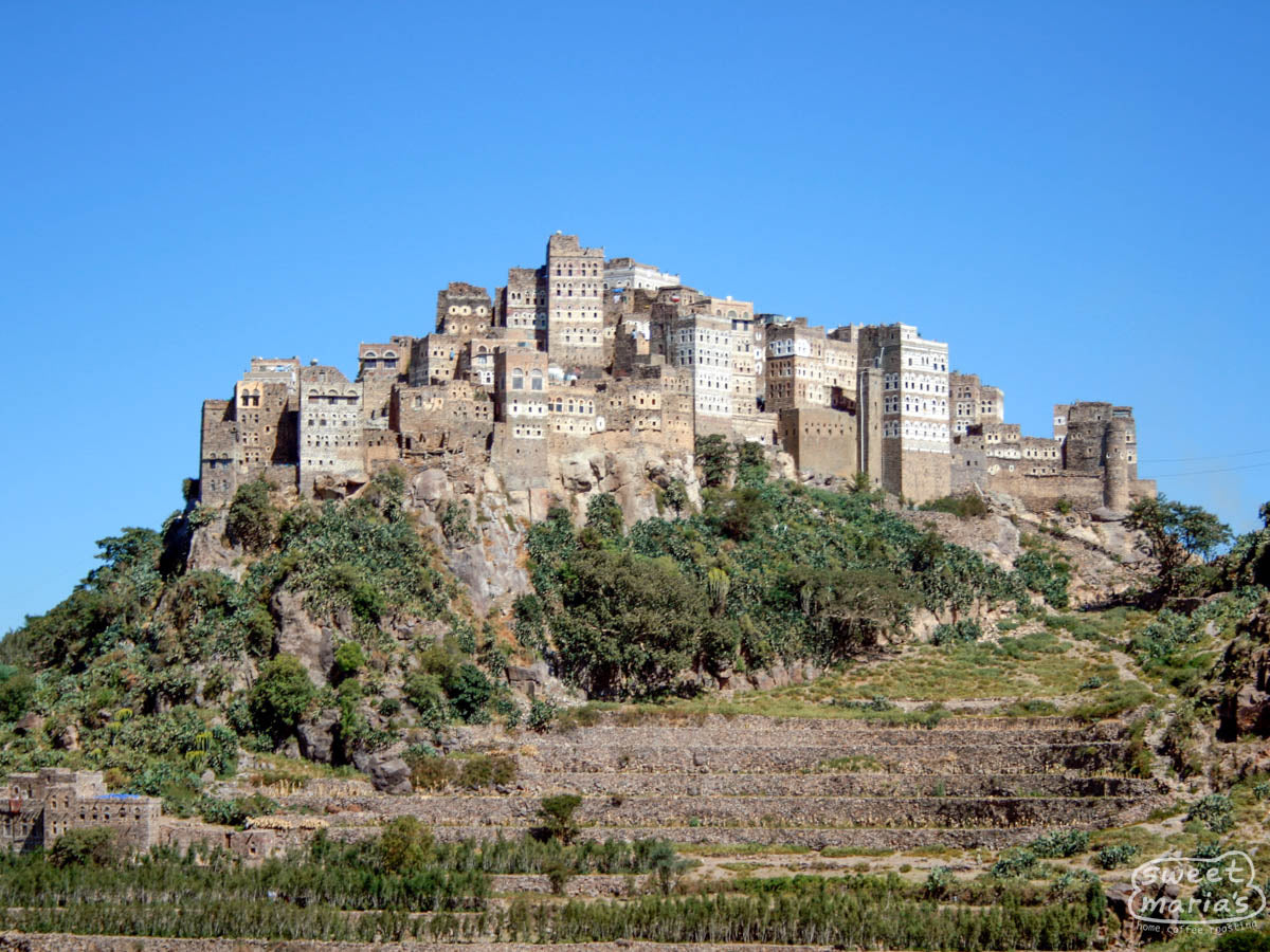 The stone city of Al Hagarah, with terraced gardens below it.
