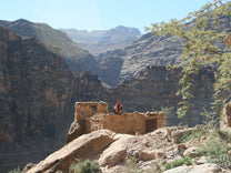  seemingly carved out of the rocky cliffs below. Yemen.