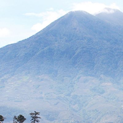 The awe-inspiring Acatenango volcanos and it's two peaks (Pico Mayor and Yepocapa), part of the Sierra Madre mountain range, and can be seen from the city of Antigua, Guatemala.