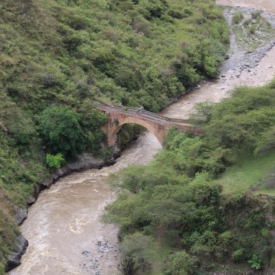 Looking down at the old stone bridge that spans a section of Rio Juanambú. Puente Juanambú, Buesaco, Nariño, Colombia.