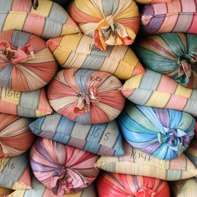 Colorful mylar bags filled with parchment coffee at the warehouse in Buesaco town, Nariño.