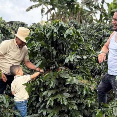 Franky (right) at his farm, Buena Vista, with his father and son. Pitalito, Colombia.