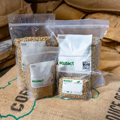 A white plastic stand-up pouch bag for storing roasted coffee. 
