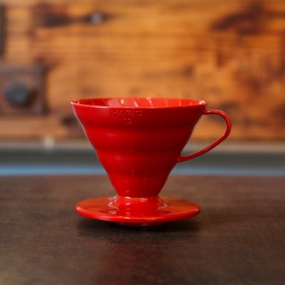 The Hario V60 Plastic coffee dripper in red, number 2 size.