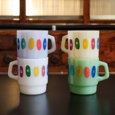 The Sweet Maria's Milk Glass Mugs are stackable, made of thick, opaque colored glass.