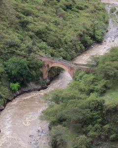 Looking down at the old stone bridge that spans a section of Rio Juanambú. Puente Juanambú, Buesaco, Nariño, Colombia.