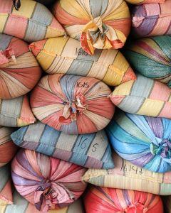 Colorful mylar bags filled with parchment coffee at the warehouse in Buesaco town, Nariño.