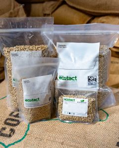 A white plastic stand-up pouch bag for storing roasted coffee. 