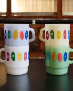 The Sweet Maria's Milk Glass Mugs are stackable, made of thick, opaque colored glass.